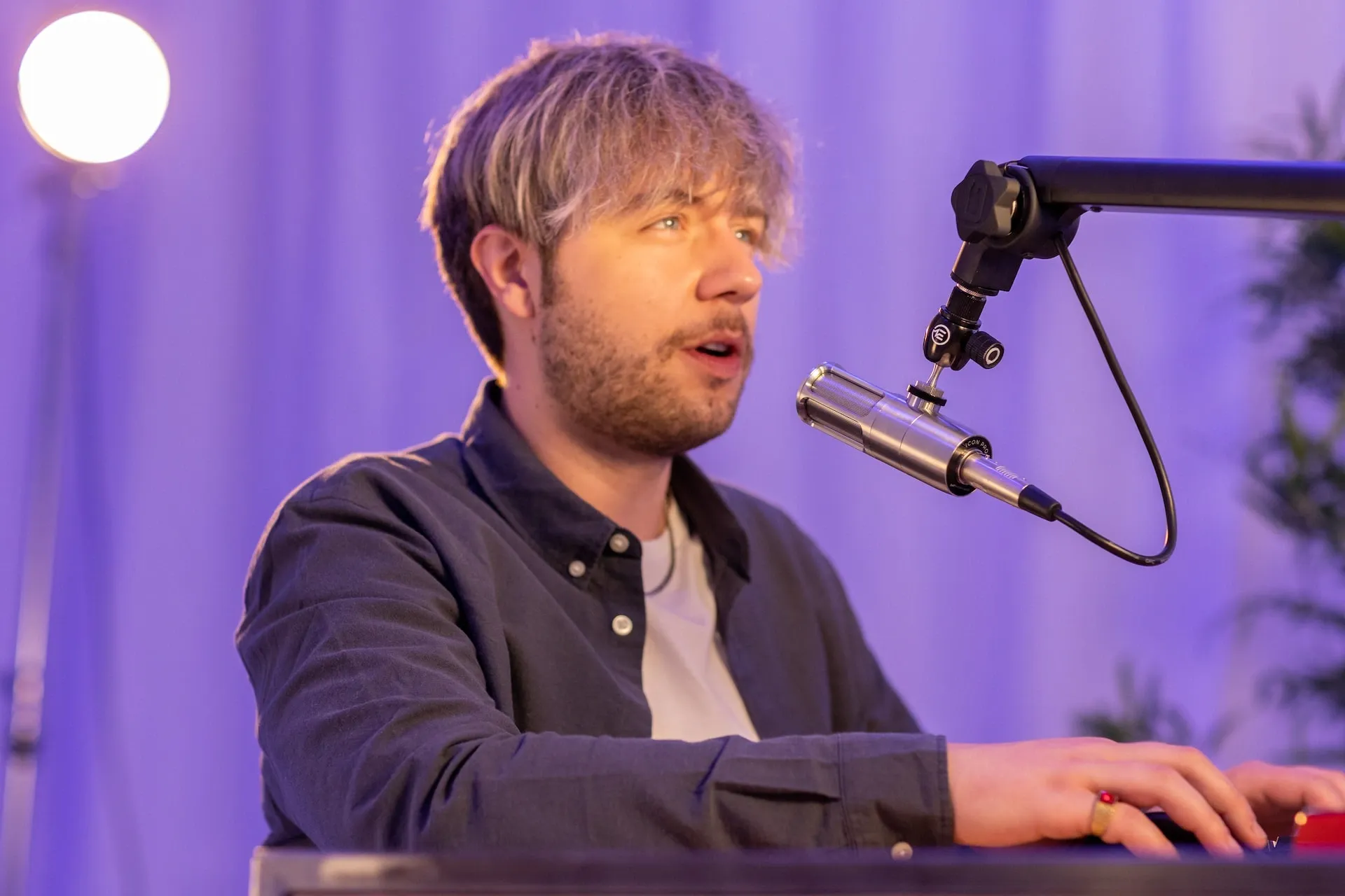 man speaking into microphone